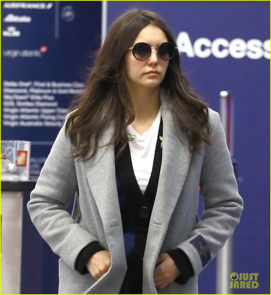 nina dobrev catches a flight with her family 02
