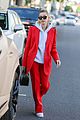 hailey bieber red suit dog ruins tree 01