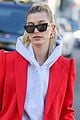 hailey bieber red suit dog ruins tree 03