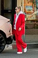 hailey bieber red suit dog ruins tree 04