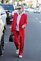 hailey bieber red suit dog ruins tree 05