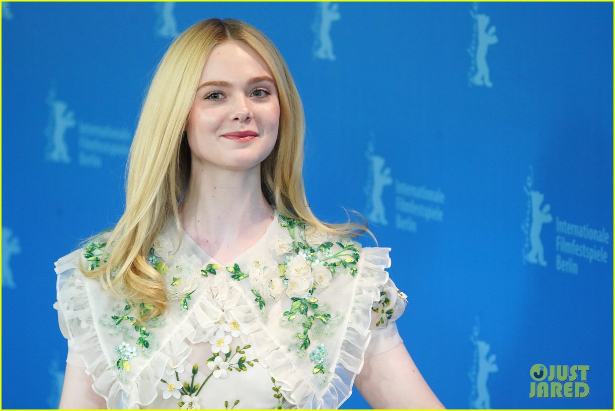 elle fanning wears fresh off the runway dress to the roads not taken photo call 01