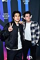 charles melton casey cott meet up with another cw star at super bowl party 03