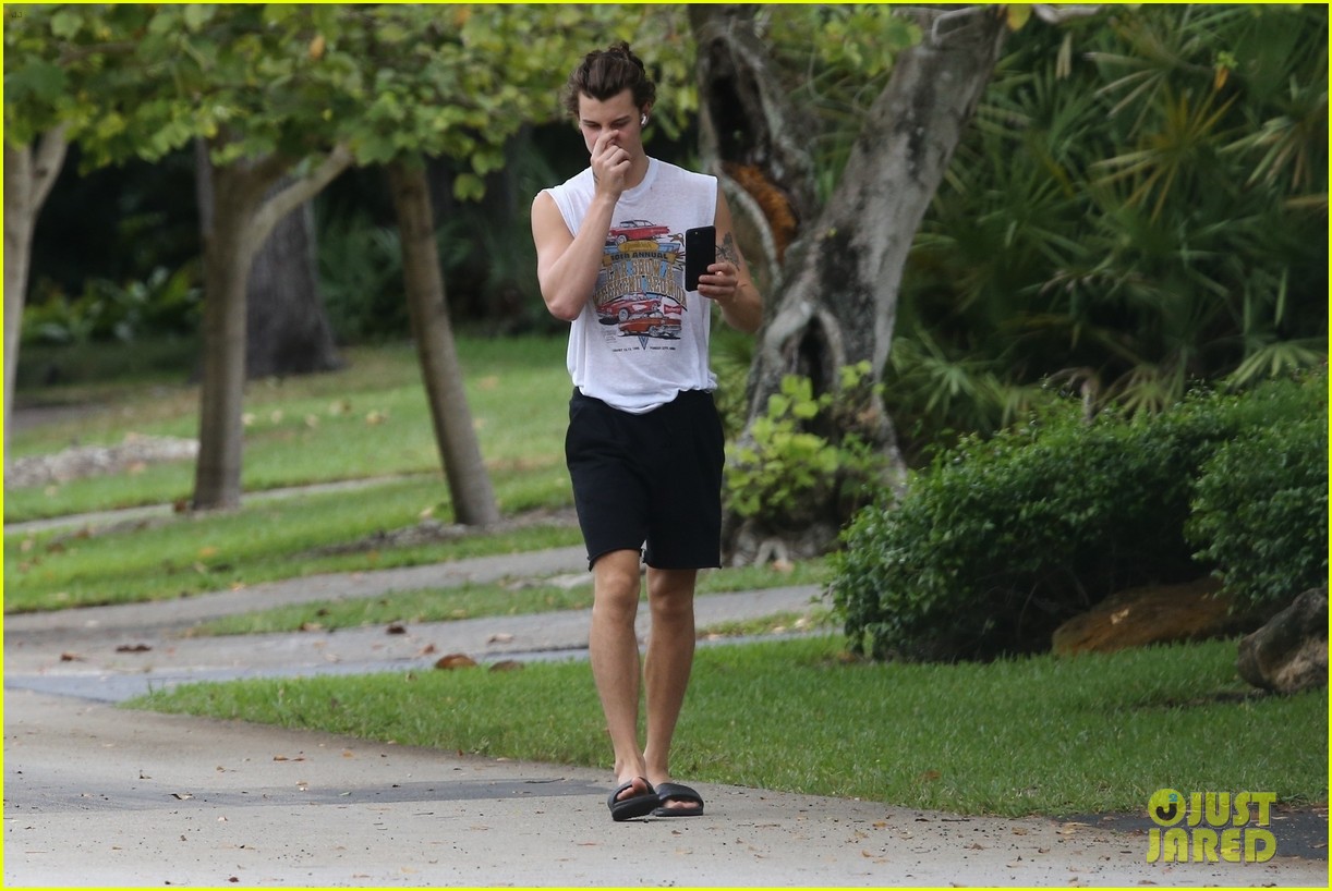 shawn mendes takes a call during his neighborhood stroll 07