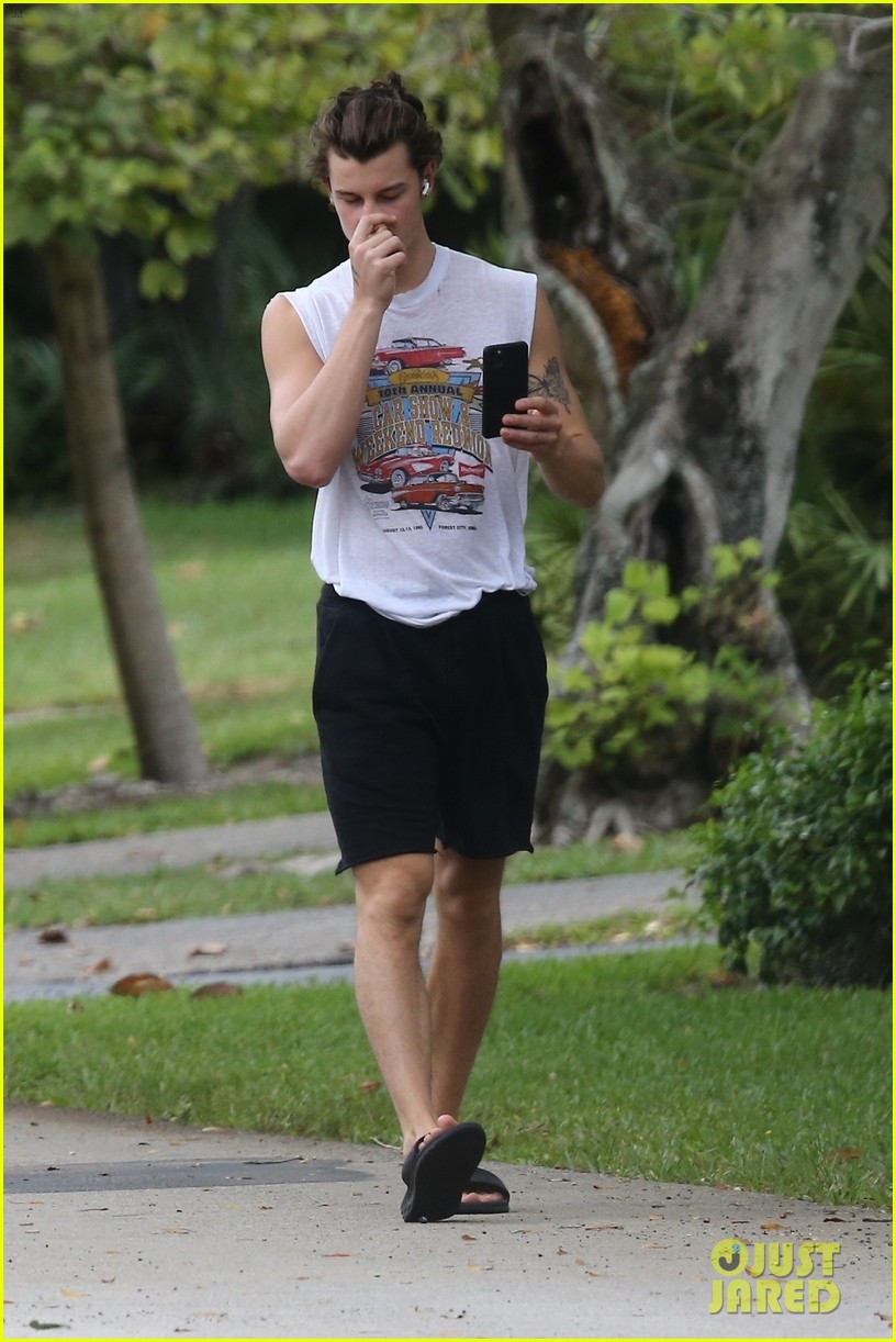 shawn mendes takes a call during his neighborhood stroll 08