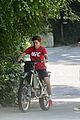 kj apa learns how to ride a dirt bike with alex fines help 16