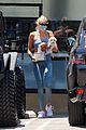 kaia gerber blue look carrying puppy 01