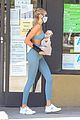 kaia gerber blue look carrying puppy 05