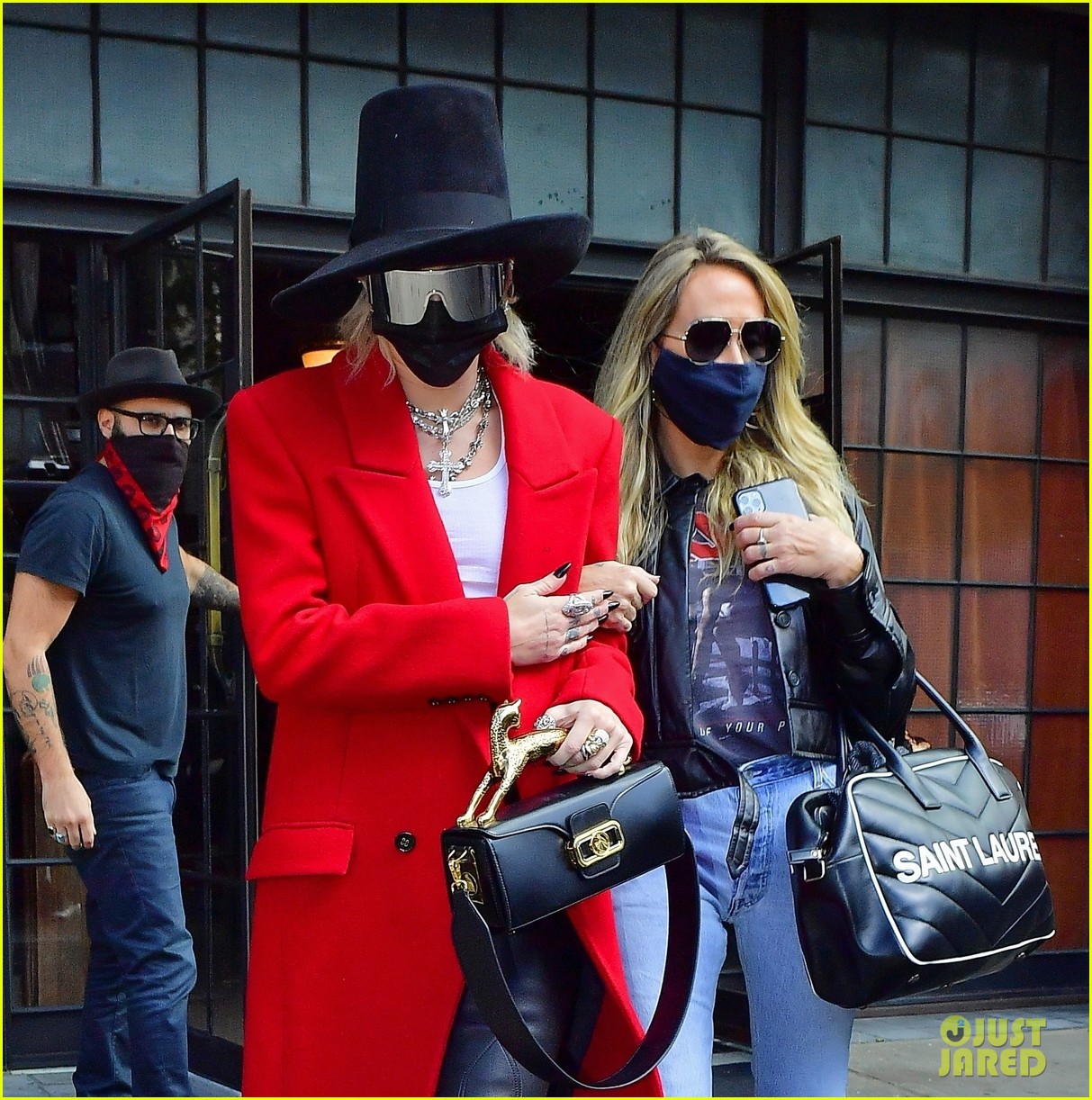 miley cyrus tophat red coat leaving hotel mom nyc 10