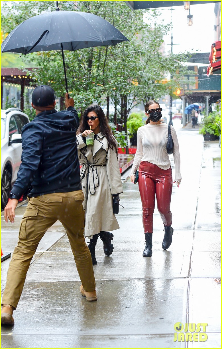 Full Sized Photo of kourtney kardashian umbrella holder addison rae 01