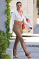 hailey bieber shows of toned midriff for business meeting 01