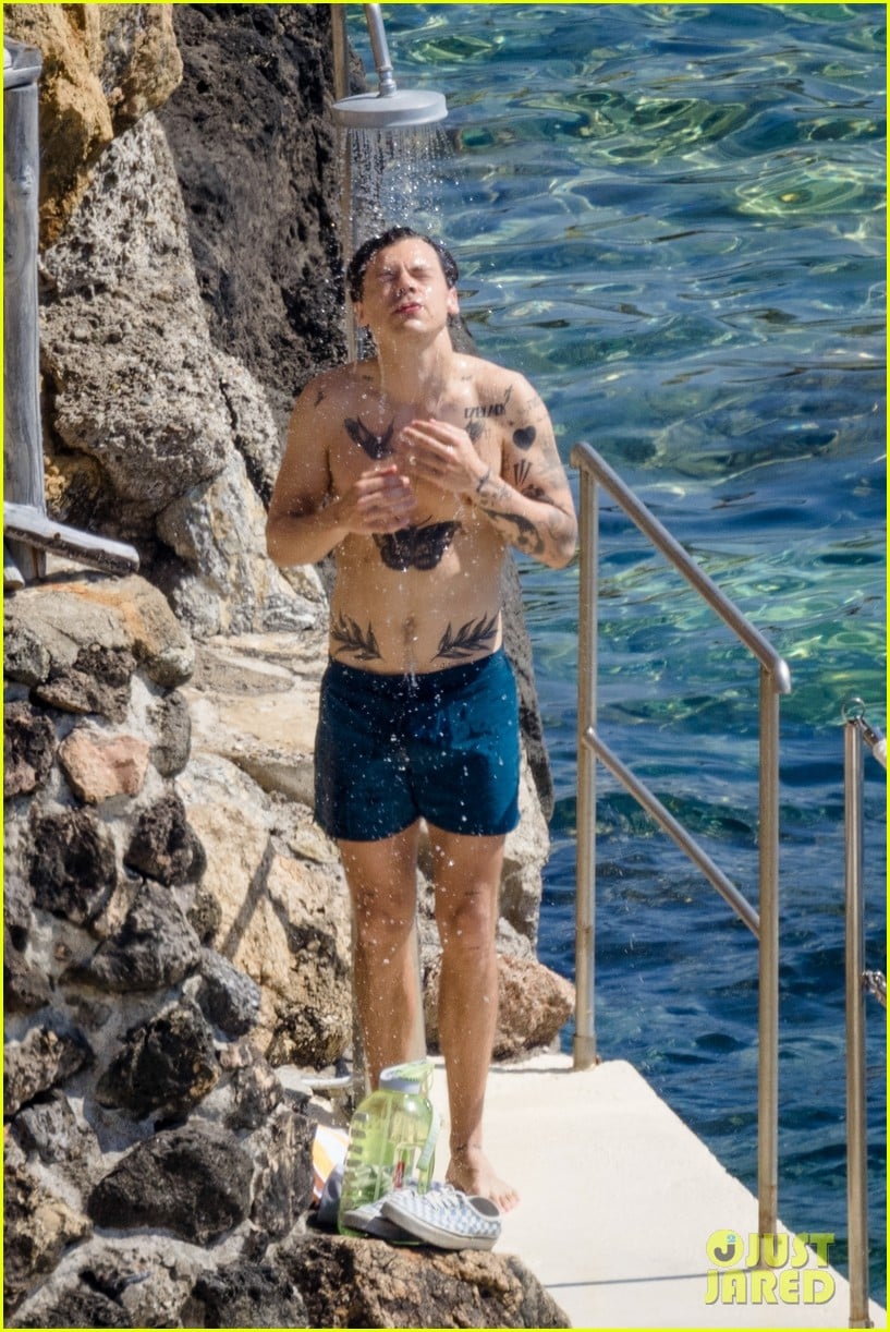 Full Sized Photo of harry styles showers shirtless in italy 09