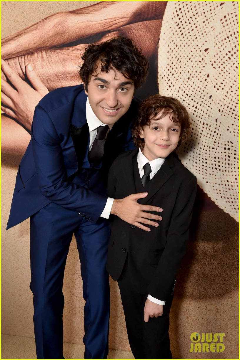alex wolff poses with younger self nolan river at old premiere 01
