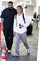 hailey bieber shows off fit figure in crop top sweater plaid pants 08