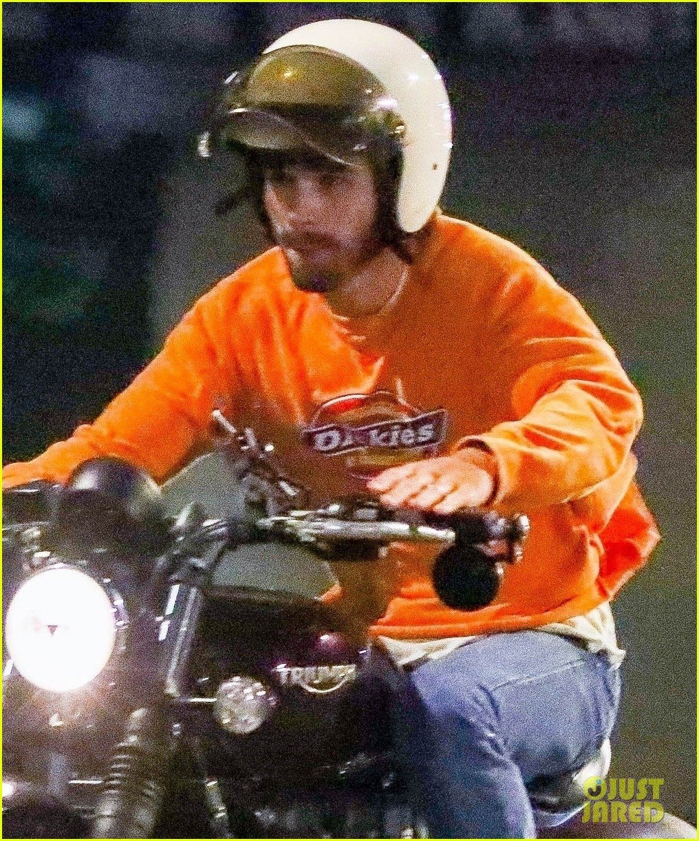 kj apa rides his motorcycle to dinner with friends 03