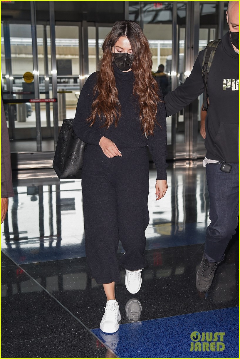 Selena Gomez's Louis Vuitton Bag and Sneakers at the Airport