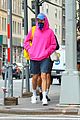 harry styles sports bright pink hooding while hanging out with friends 07