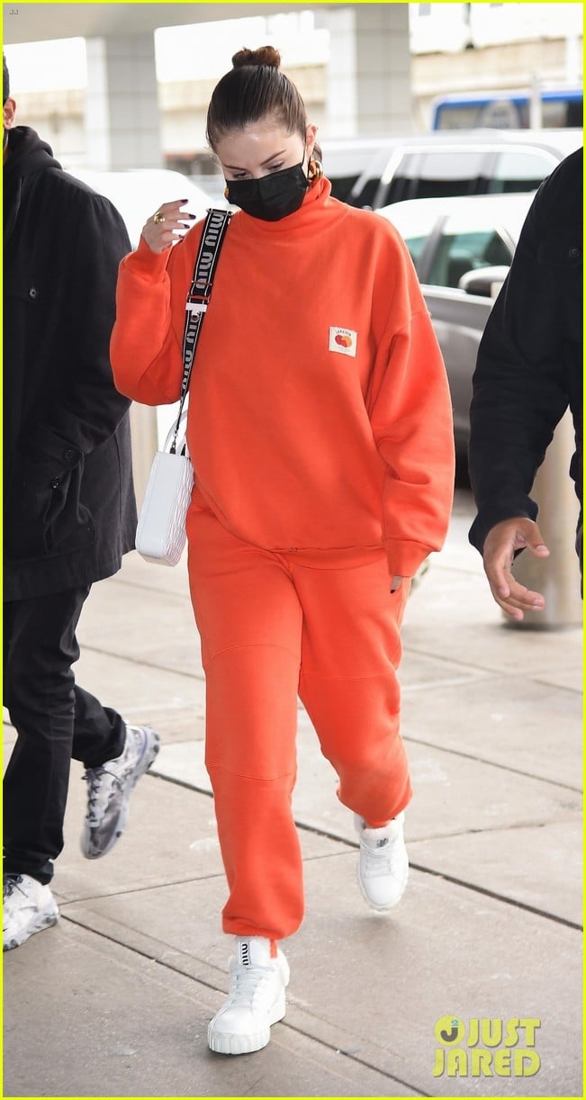 Zendaya arrives in a red hoodie at JFK Airport in New York City