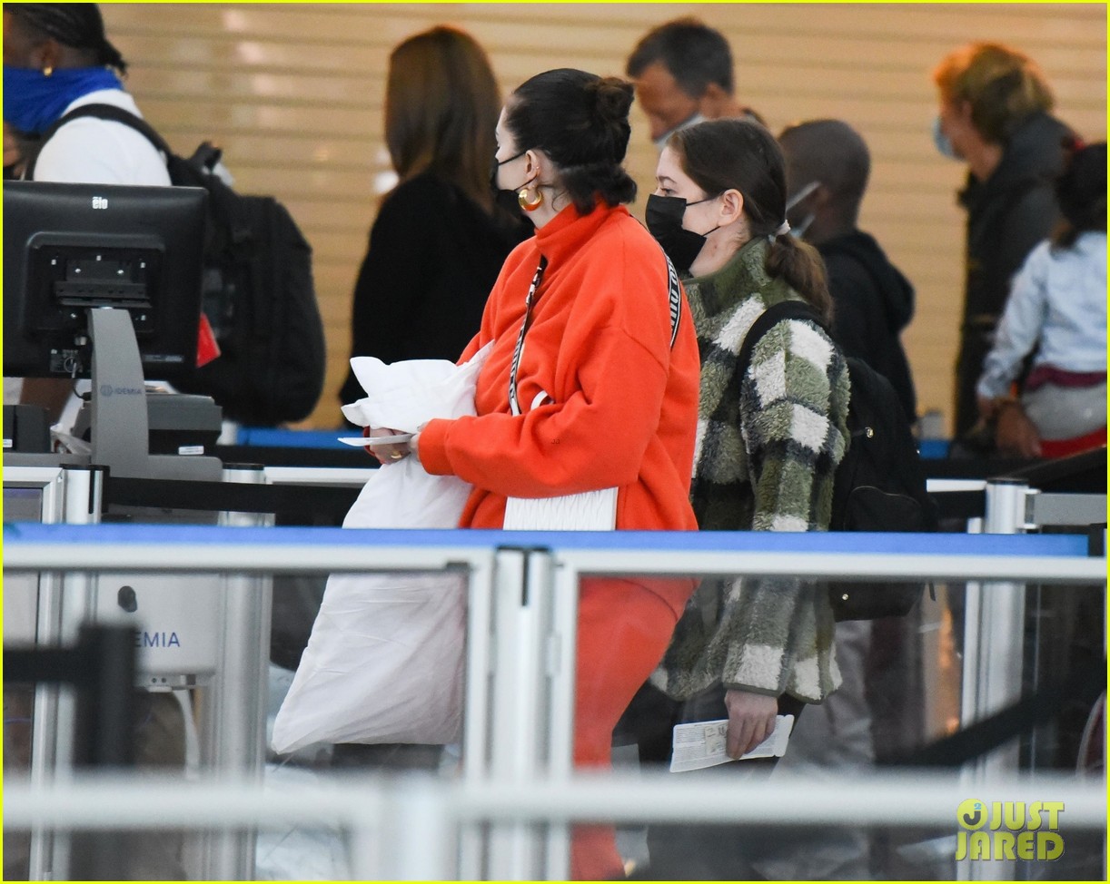 selena gomez orange tracksuit airport arrival 24