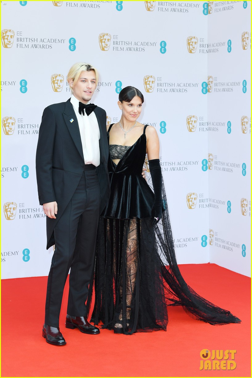 Millie Bobby Brown Attends The BAFTAs 2022 With Boyfriend Jake