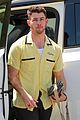 nick jonas sports bright yellow celine shirt for afternoon meeting 02