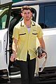 nick jonas sports bright yellow celine shirt for afternoon meeting 03