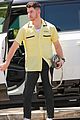 nick jonas sports bright yellow celine shirt for afternoon meeting 05