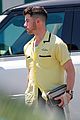 nick jonas sports bright yellow celine shirt for afternoon meeting 10