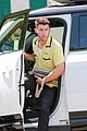nick jonas sports bright yellow celine shirt for afternoon meeting 11