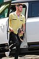nick jonas sports bright yellow celine shirt for afternoon meeting 13