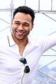 corbin bleu joshua bassett jump for joy in front of hsmtmts times square billboard 04
