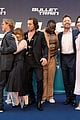 joey king gets squished between brad pitt aaron taylor johnson at premiere 01