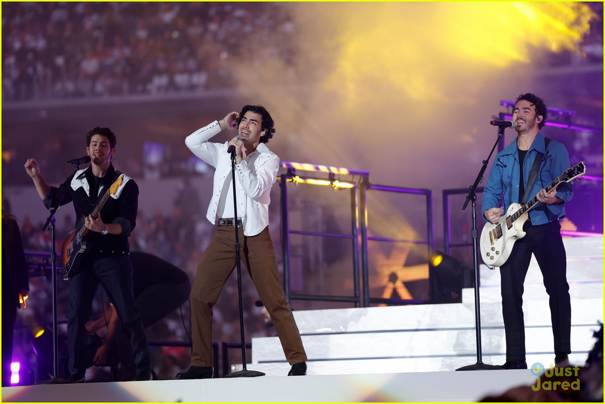 Joe Jonas, of the Jonas Brothers, performs during halftime of an