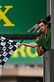 tom holland waves checkered flag at f1 monaco grand prix 04