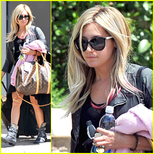 Ashley Tisdale wearing Louis Vuitton Speedy Cube Bag.