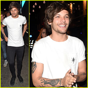 Louis Tomlinson is all smiles as he leaves nightclub with mystery