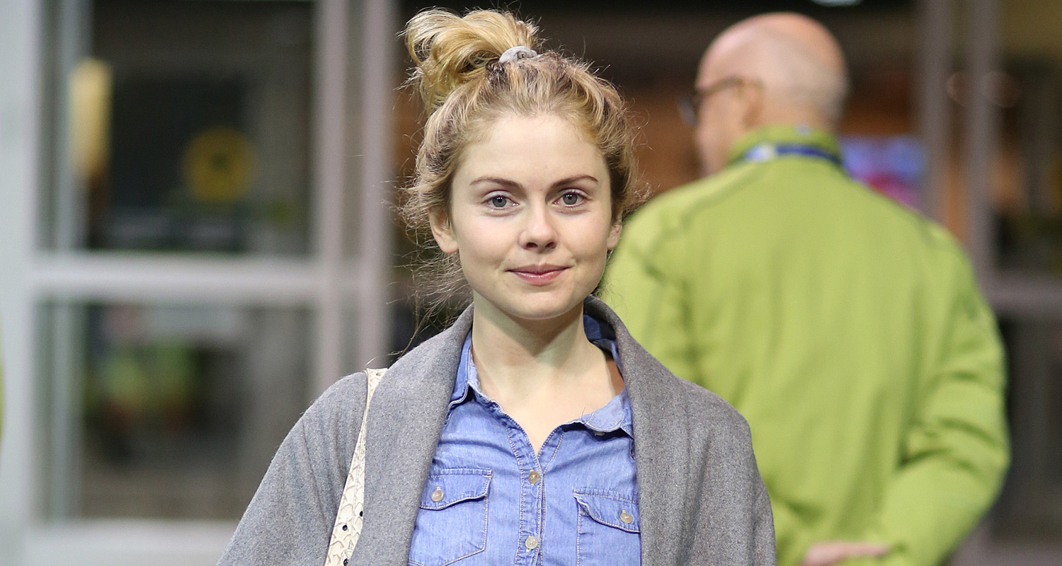 Rose McIver stops to pose for a fan selfie while touching down at the airpo...