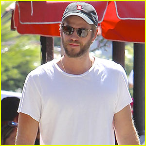 Liam Hemsworth Cozies Up with Miley Cyrus' Dog!