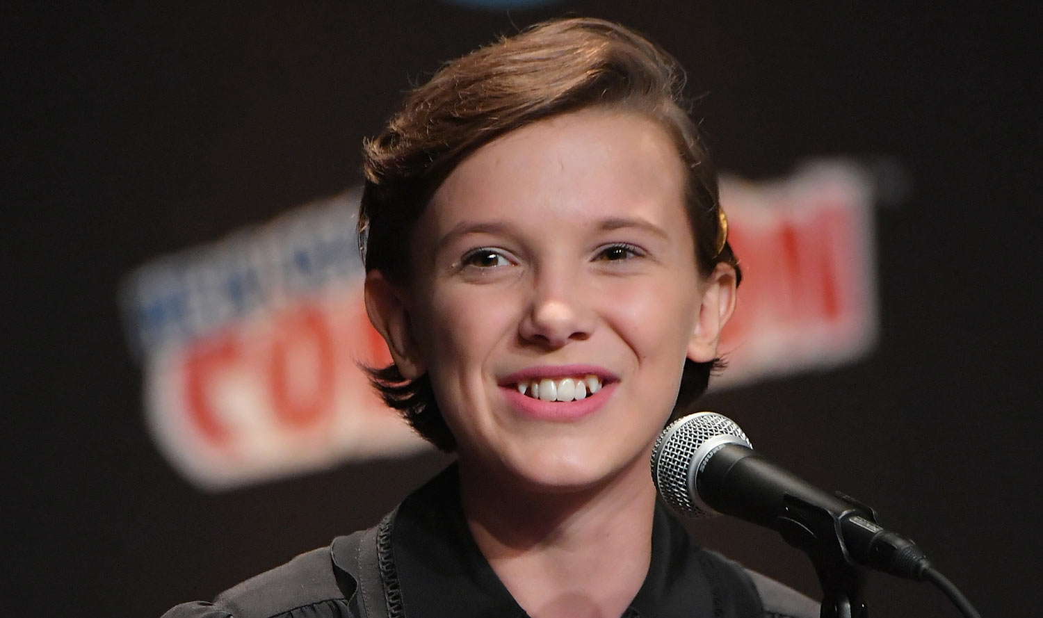 Millie Bobby Brown flashes a smile as she answers questions at her Stranger...