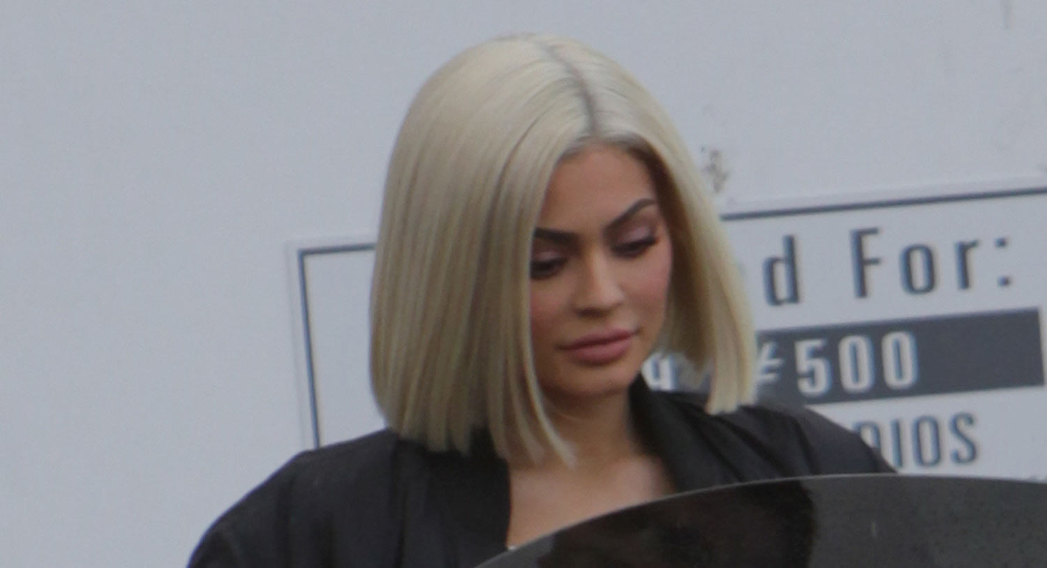 Kylie Jenner returns to platinum blonde bob as she flashes her bum