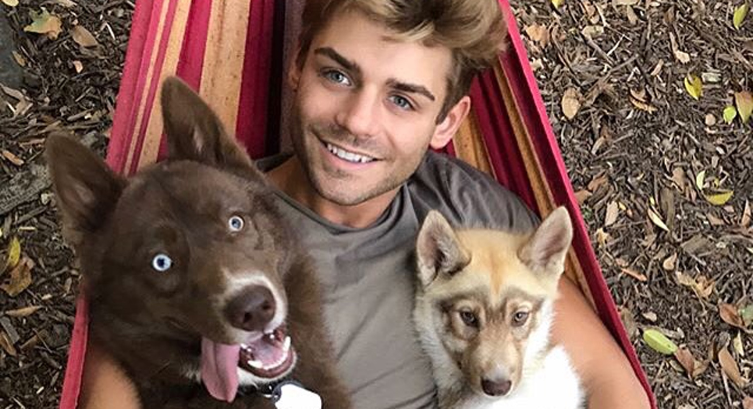 Garrett Clayton Cuddles With His Pups We Can T Handle The Cuteness Celebrity Pets Garrett Clayton Just Jared Jr