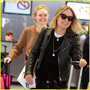 Elle Fanning Flashes a Grin While Landing in NYC After Paris Fashion Week