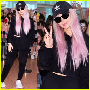 Dove Cameron Rocks Pink Hair While Arriving in Japan