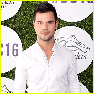 Taylor Lautner Shows Off His Taco Bell Hot Sauce Onesie