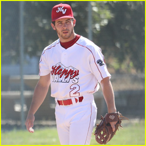 Nick Jonas of the Jonas Brothers waits to play softball against a team of  Marquis Jet and NetJets players at Newark Bears Stadium in Newark, New  Jersey on July 15, 2009. (UPI