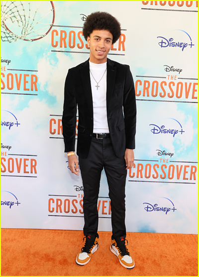 Joshua Caleb Johnson on the orange carpet at the The Crossover premiere
