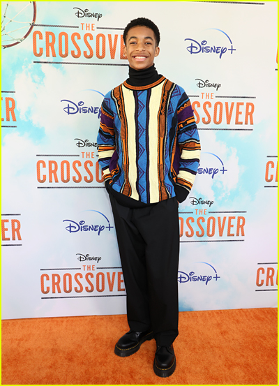 Isaiah Russell-Bailey on the orange carpet at the The Crossover premiere